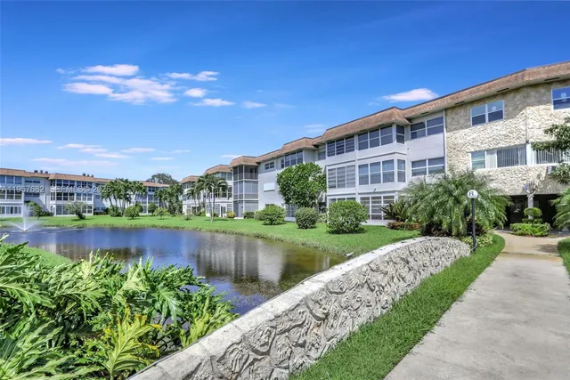 a view of a lake with a house in the background