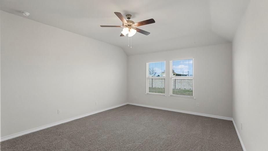 424 Epiphany Lane Lavon, TX 75166 - Photo 16 of 27 Room featuring two windows with blinds, a ceiling fan with light fixture, gray carpet, and light-toned walls