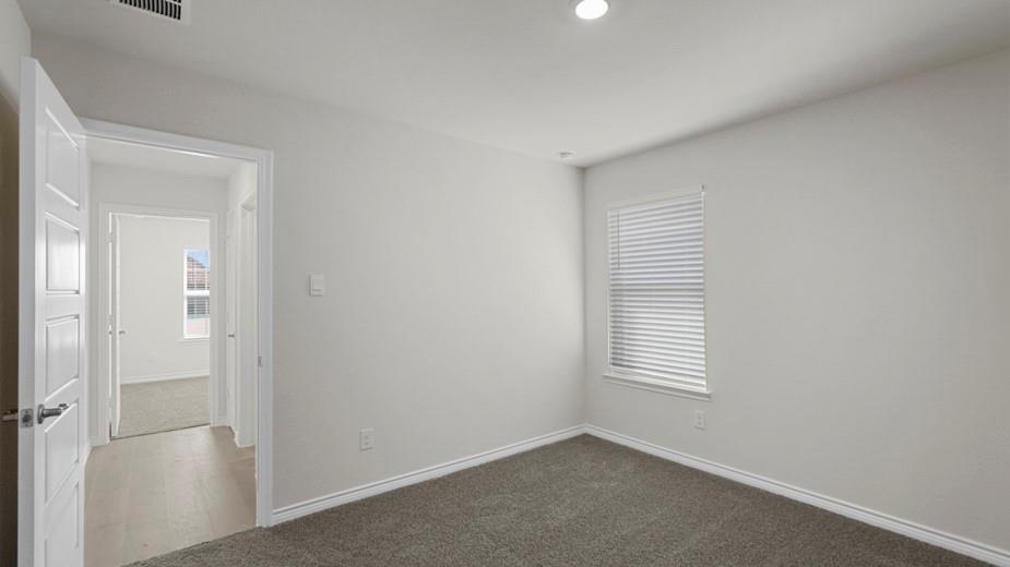 424 Epiphany Lane Lavon, TX 75166 - Photo 25 of 27 Carpeted room with recessed lighting and a window featuring horizontal blinds