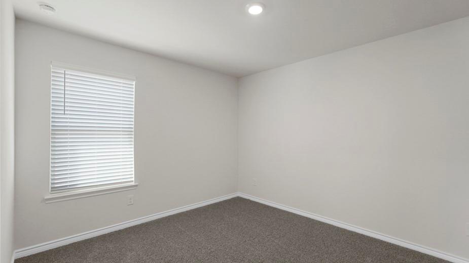424 Epiphany Lane Lavon, TX 75166 - Photo 26 of 27 Neutral-toned interior with a window featuring horizontal blinds, recessed lighting, and grey textured carpeting