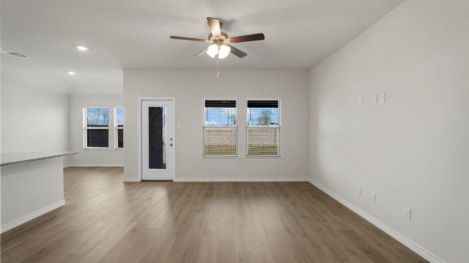 424 Epiphany Lane Lavon, TX 75166 - Photo 10 of 27 Spacious interior featuring wood-finish flooring and a neutral color palette