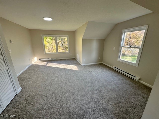 5841 Neff Road Valley City, OH 44280 - Photo 15 of 24 Bonus room with a baseboard radiator, vaulted ceiling, and light carpet