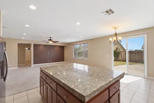a kitchen with stainless steel appliances granite countertop a sink and cabinets