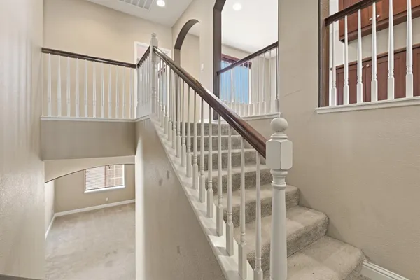 a view of a bathroom from a hallway