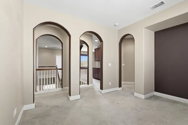 a view of a livingroom with a ceiling fan window and hardwood floor