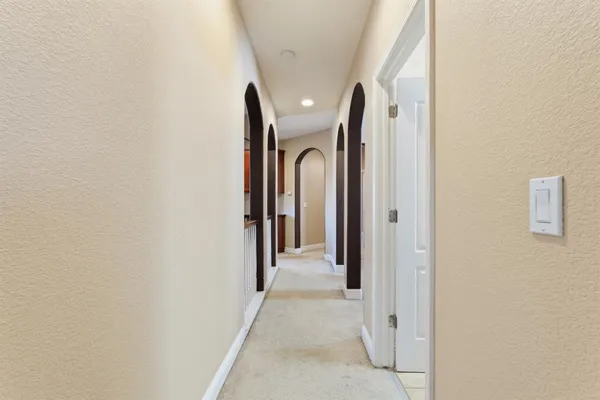a spacious bathroom with a tub shower and sink