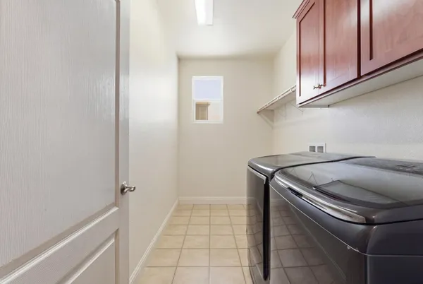 a bathroom with a granite countertop sink mirror and bathtub