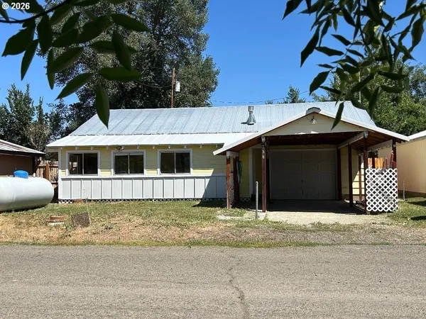 a front view of a house with a garage