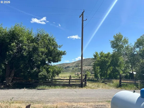 a view of a two chairs in the side of a building