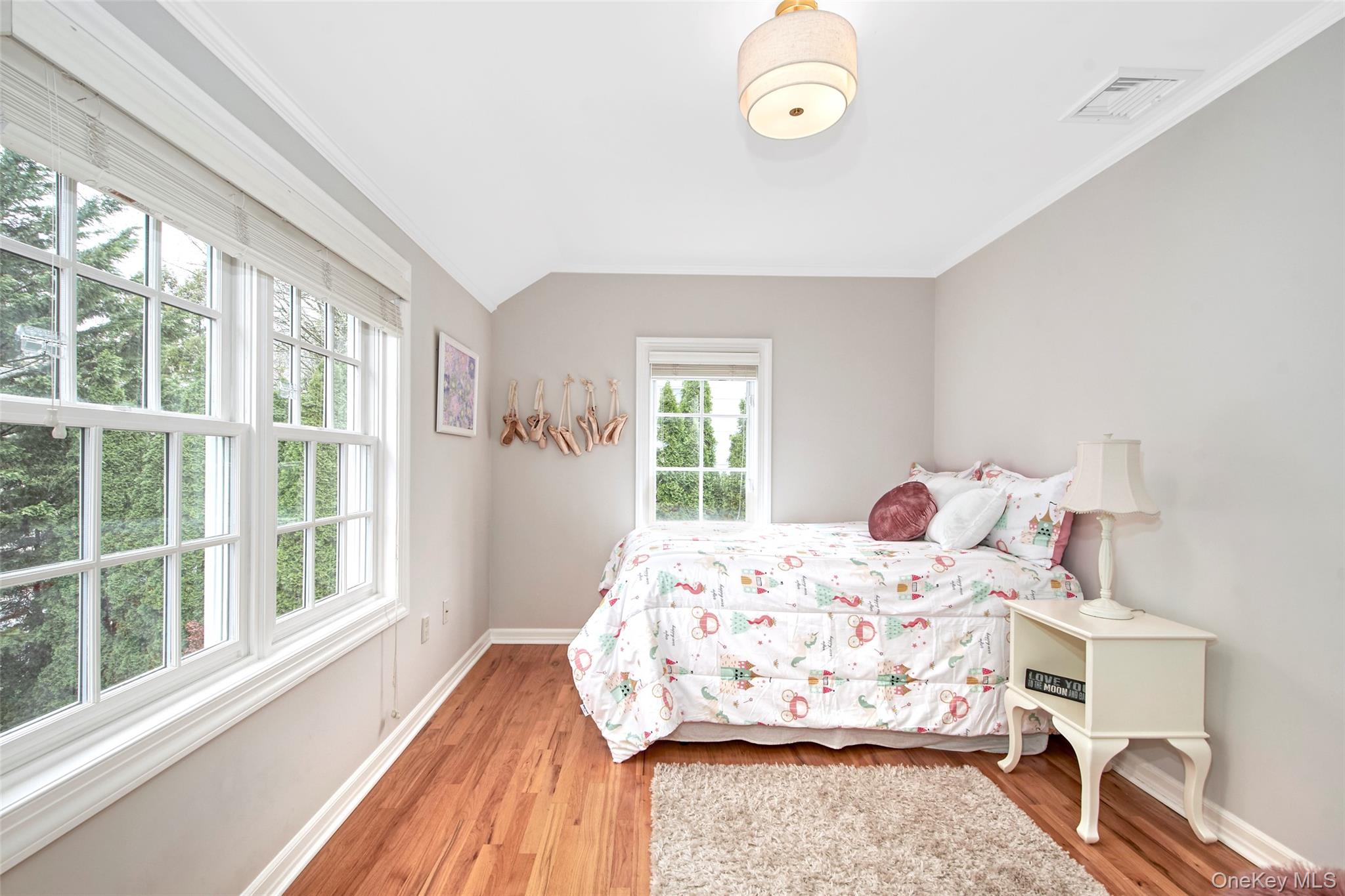 52 Intervale Place Rye, NY 10580 - Photo 13 of 26 a bedroom with a bed and a large window