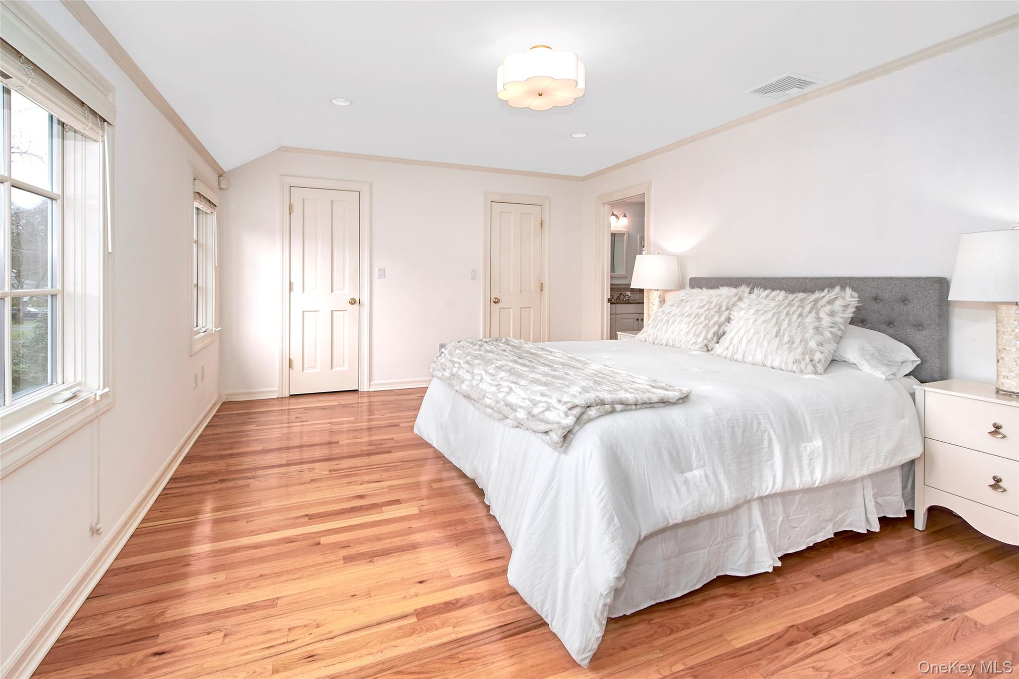 52 Intervale Place Rye, NY 10580 - Photo 15 of 26 a spacious bedroom with a bed and wooden floor