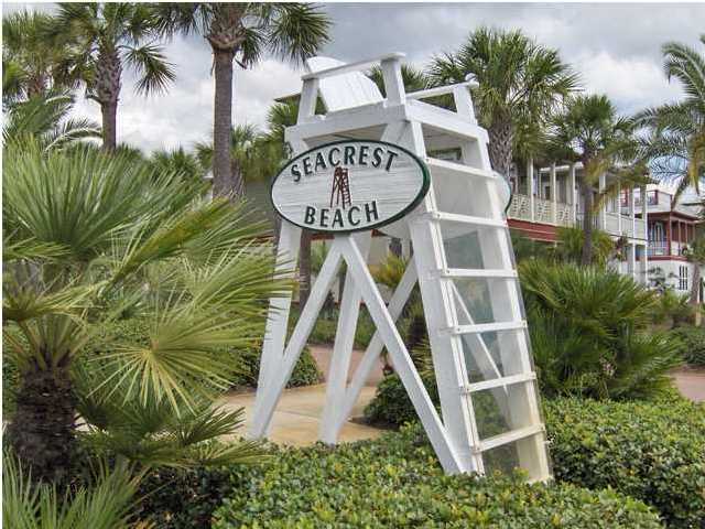 Lot 3 Lifeguard Loop Seacrest, FL 32461 - Photo 2 of 6 a view of a multi story residential apartment building with a yard and potted plants