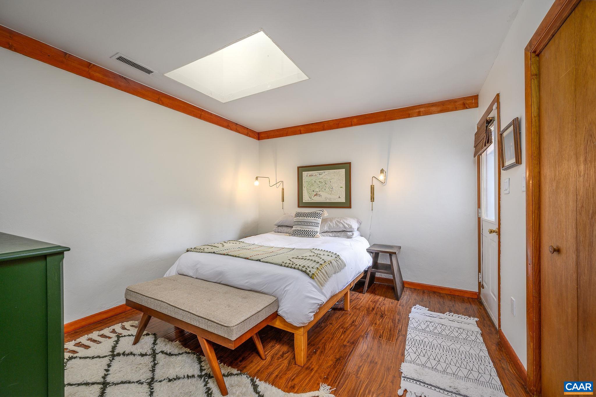 9663 Dyke Road Dyke, VA 22935 - Photo 18 of 55 a bedroom with a bed and a night stand