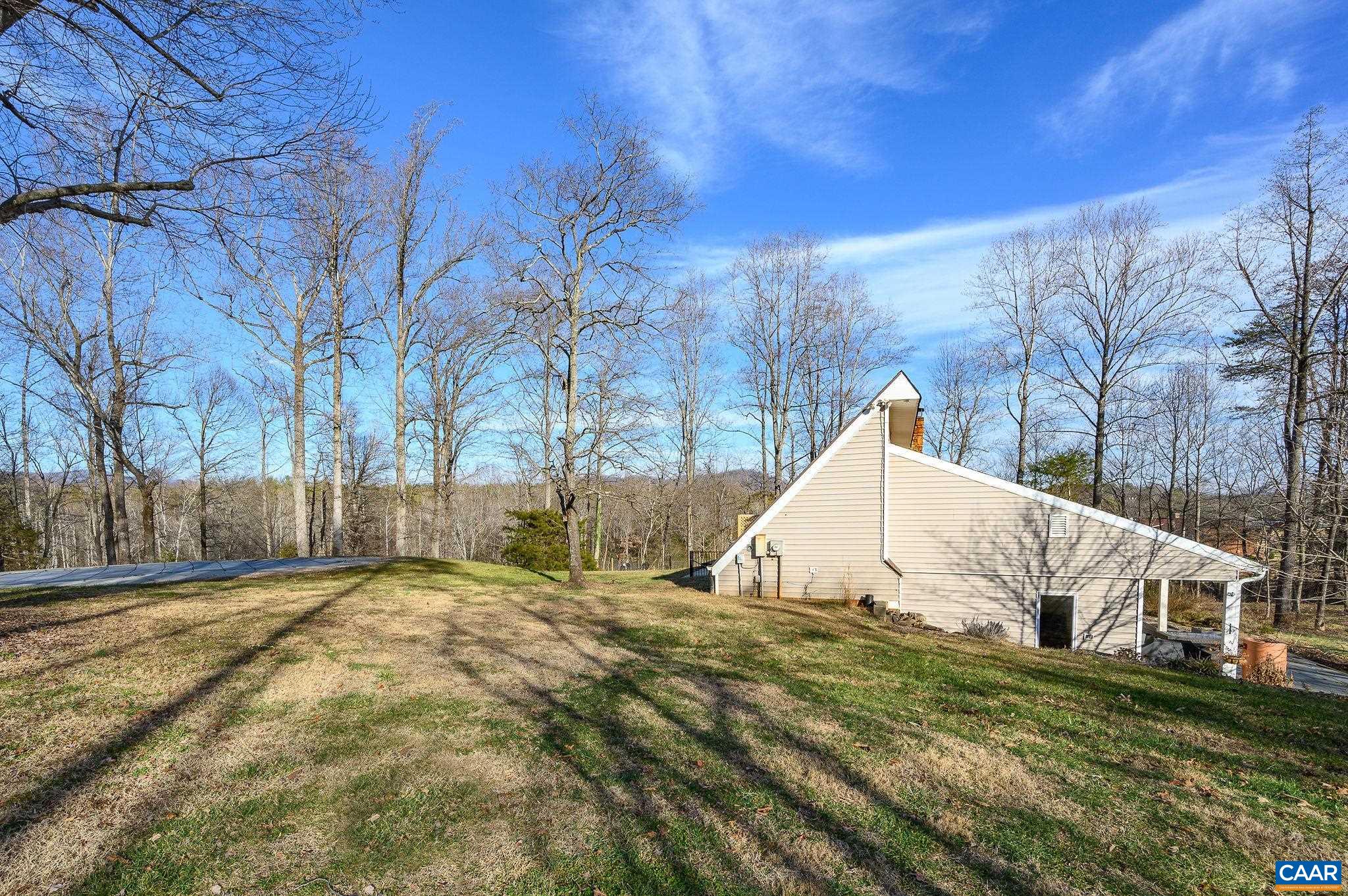 9663 Dyke Road Dyke, VA 22935 - Photo 29 of 55 a view of a couches in front of house with trees