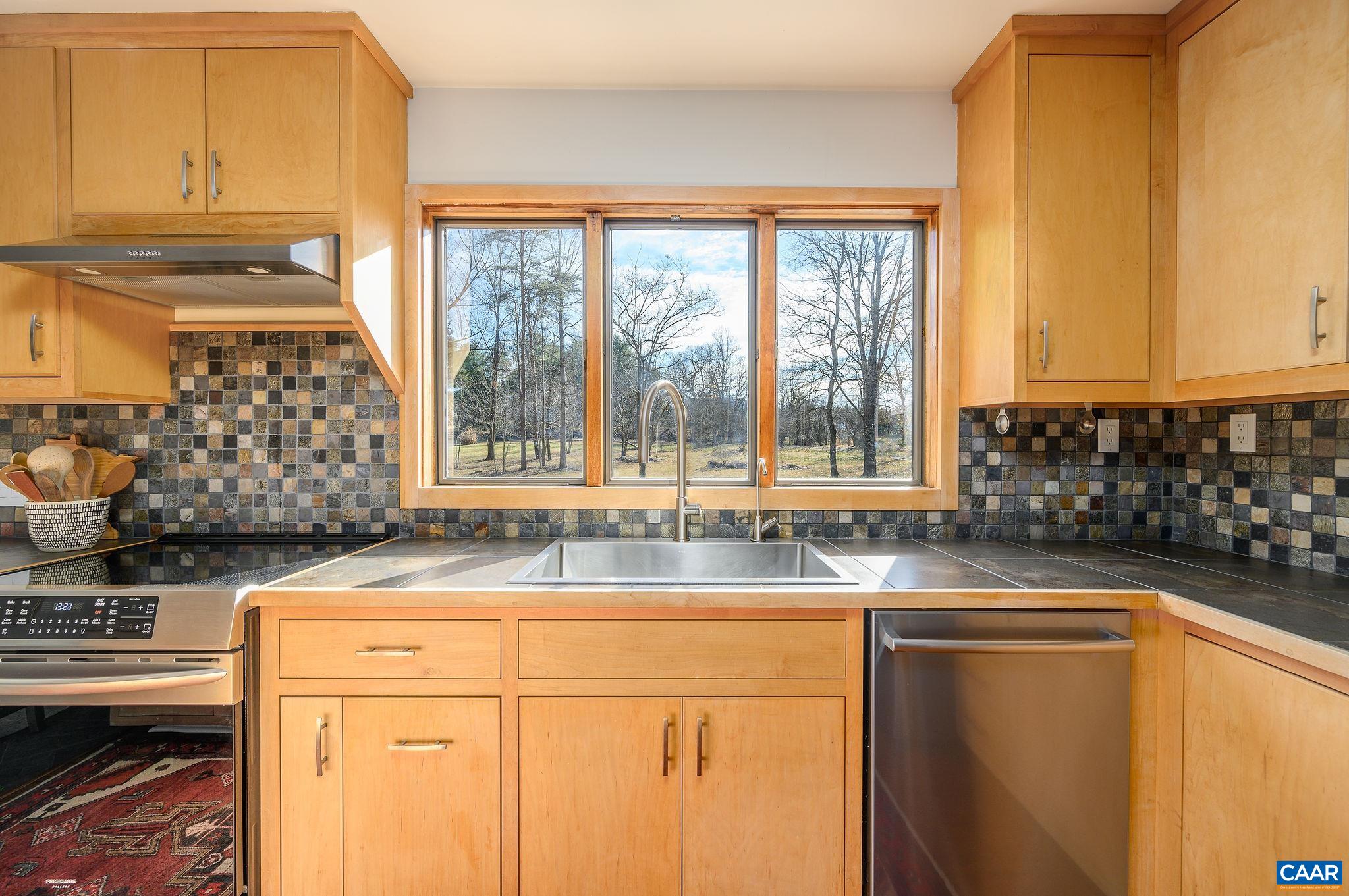 9663 Dyke Road Dyke, VA 22935 - Photo 7 of 55 a kitchen with granite countertop a sink and a window