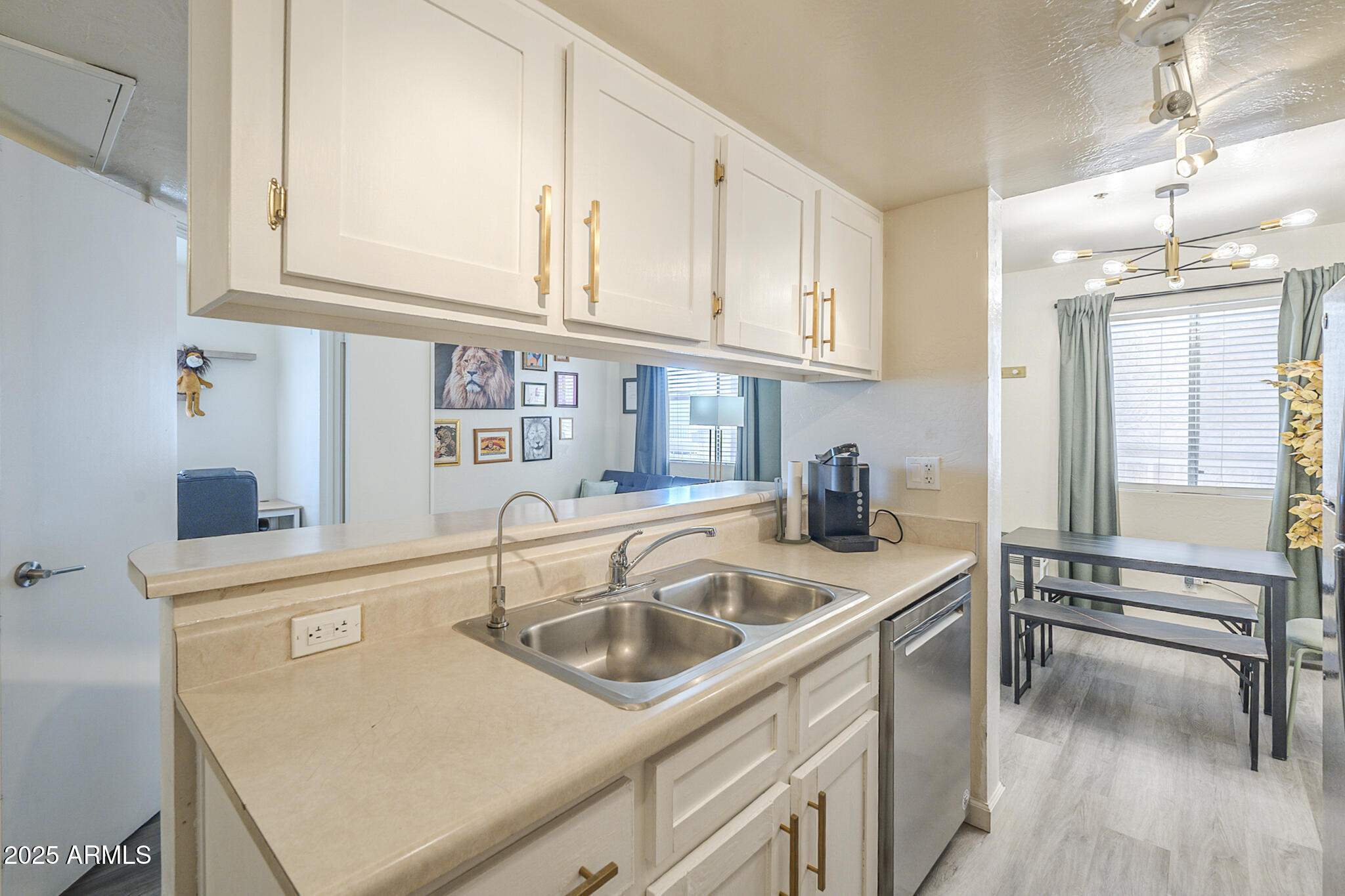 12123 West Bell Road, Unit 260 Surprise, AZ 85378 - Photo 13 of 29 a kitchen with stainless steel appliances granite countertop a sink a stove and cabinets