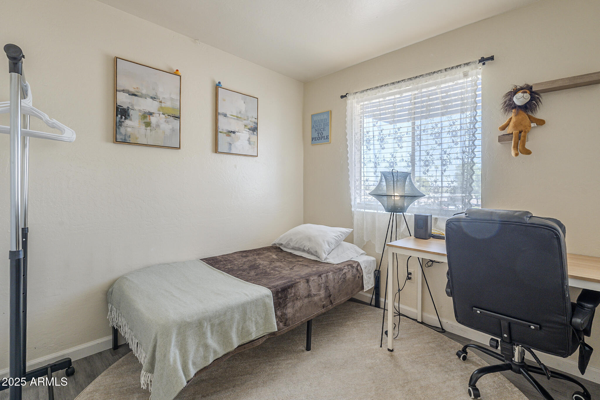 12123 West Bell Road, Unit 260 Surprise, AZ 85378 - Photo 22 of 29 a bedroom with a bed and windows