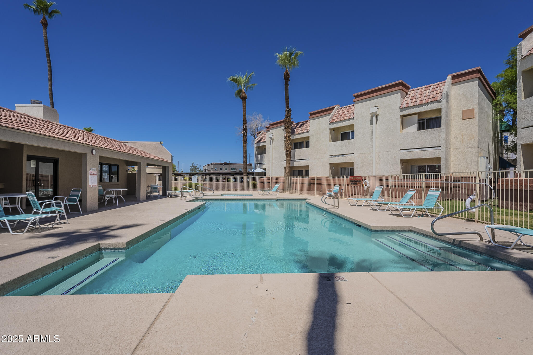 12123 West Bell Road, Unit 260 Surprise, AZ 85378 - Photo 25 of 29 a view of a house with sitting area and swimming pool