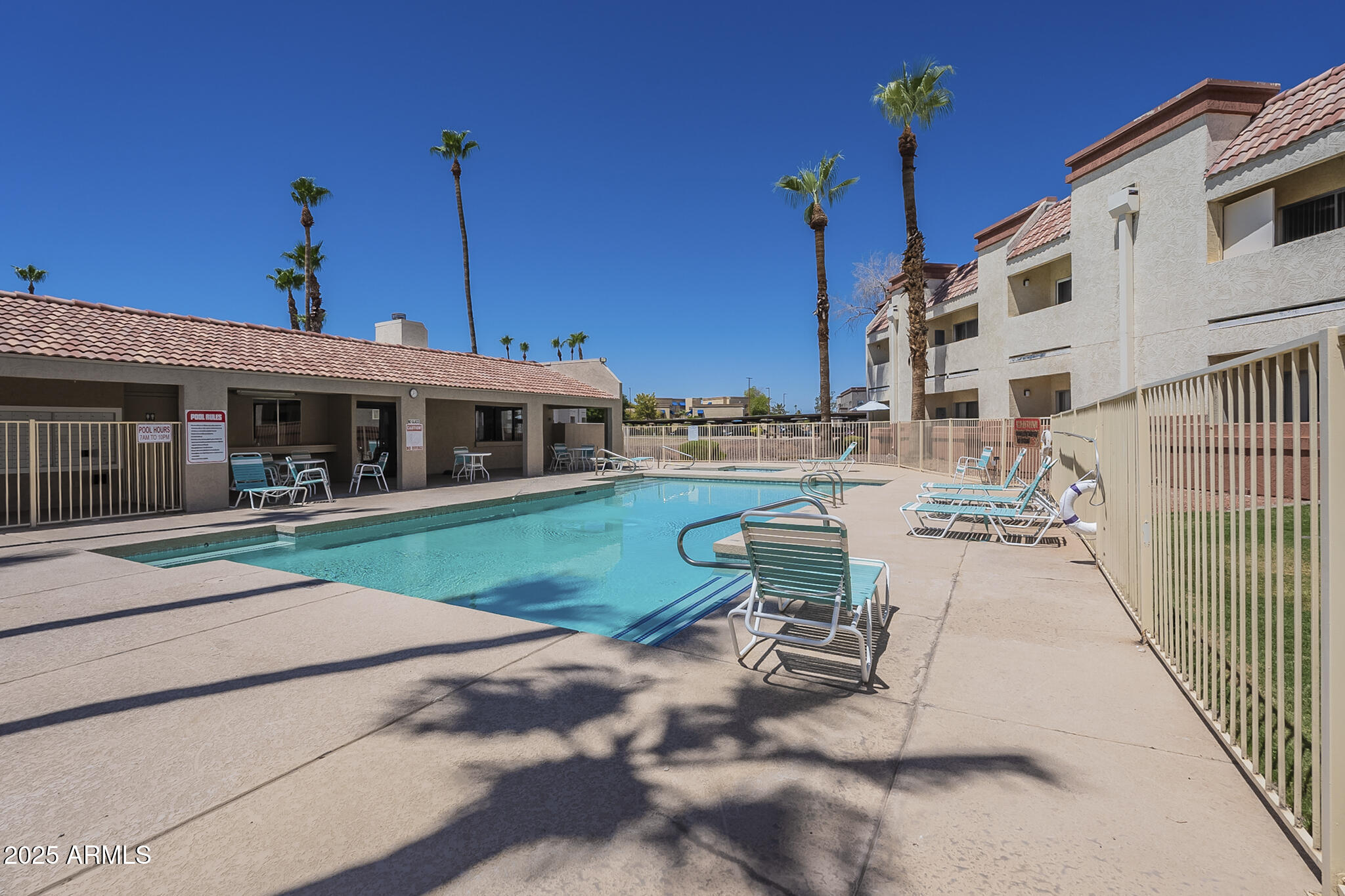 12123 West Bell Road, Unit 260 Surprise, AZ 85378 - Photo 26 of 29 a view of a house with backyard porch and sitting area