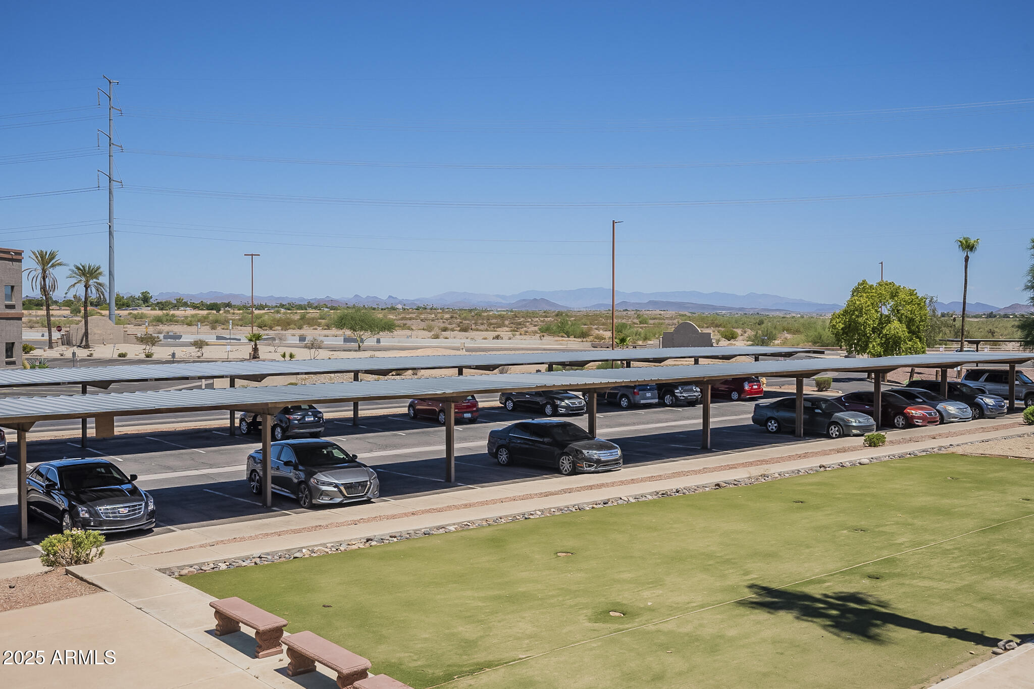 12123 West Bell Road, Unit 260 Surprise, AZ 85378 - Photo 28 of 29 a view of a swimming pool and lounge chair