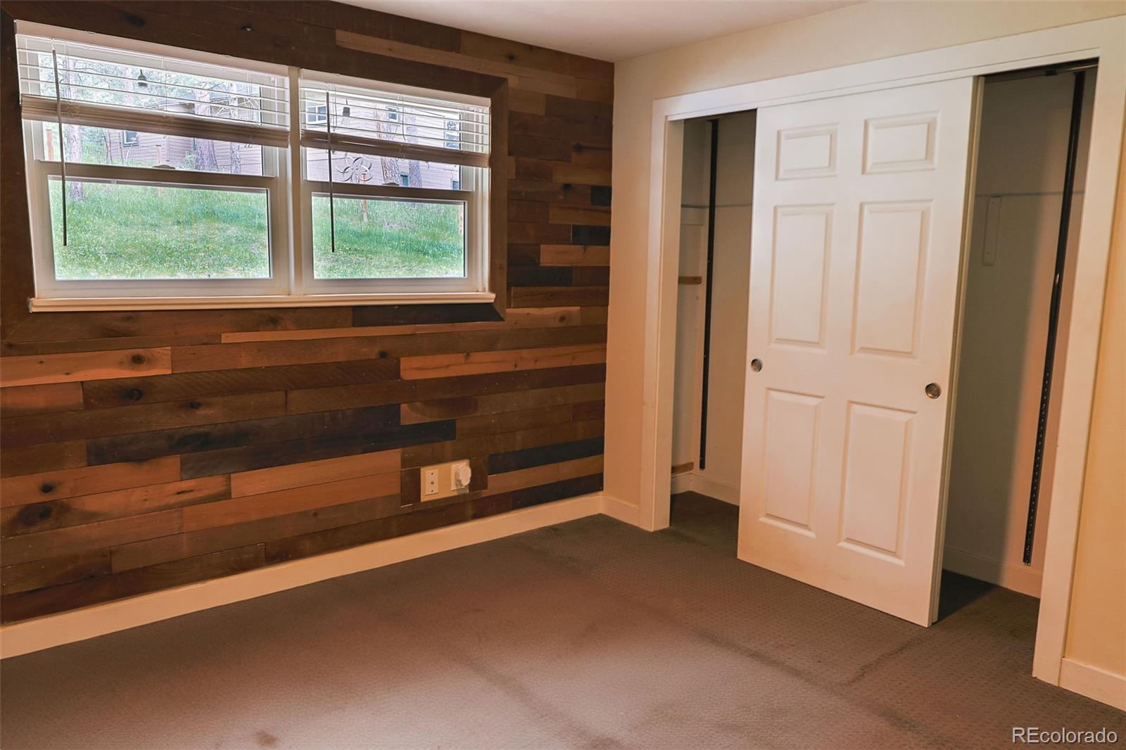 5237 South Olive Road Evergreen, CO 80439 - Photo 16 of 31 a view of an empty room with a window
