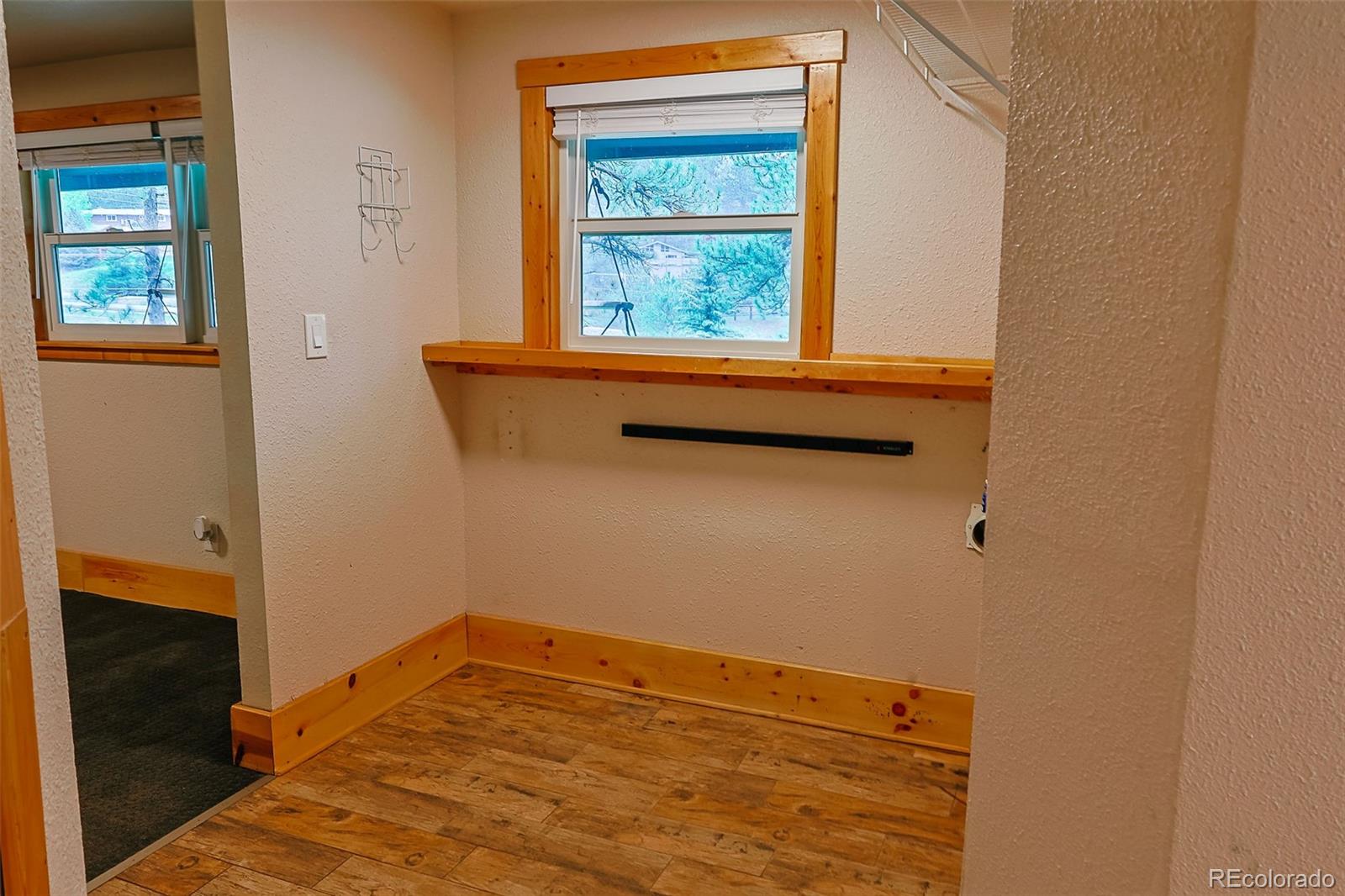 5237 South Olive Road Evergreen, CO 80439 - Photo 22 of 31 a view of a small space with wooden floor and a window