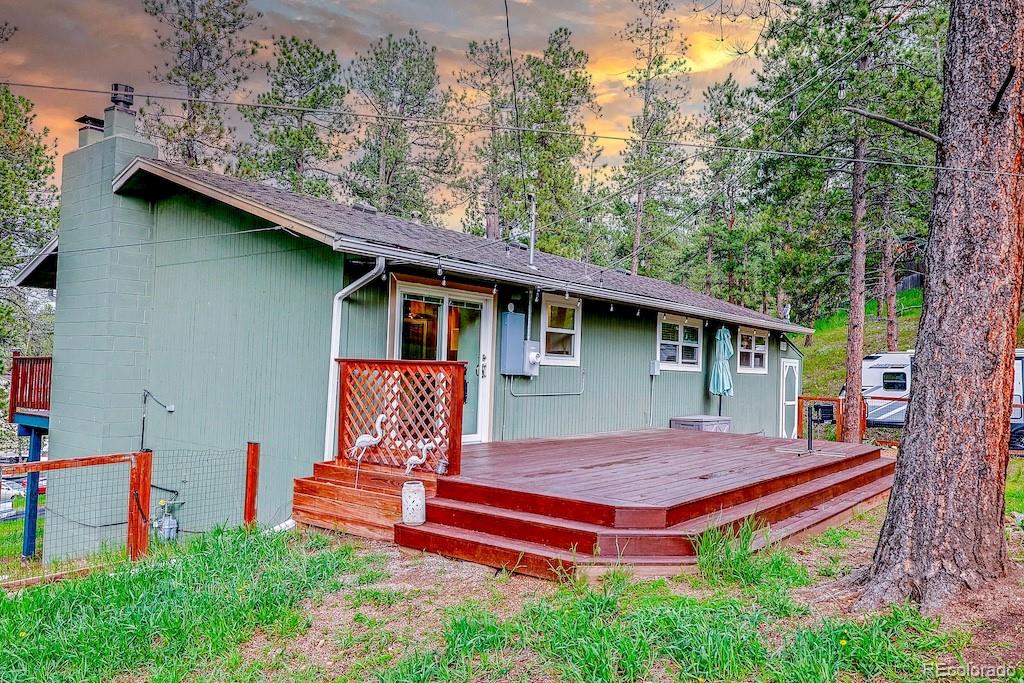5237 South Olive Road Evergreen, CO 80439 - Photo 30 of 31 a view of a backyard with a patio