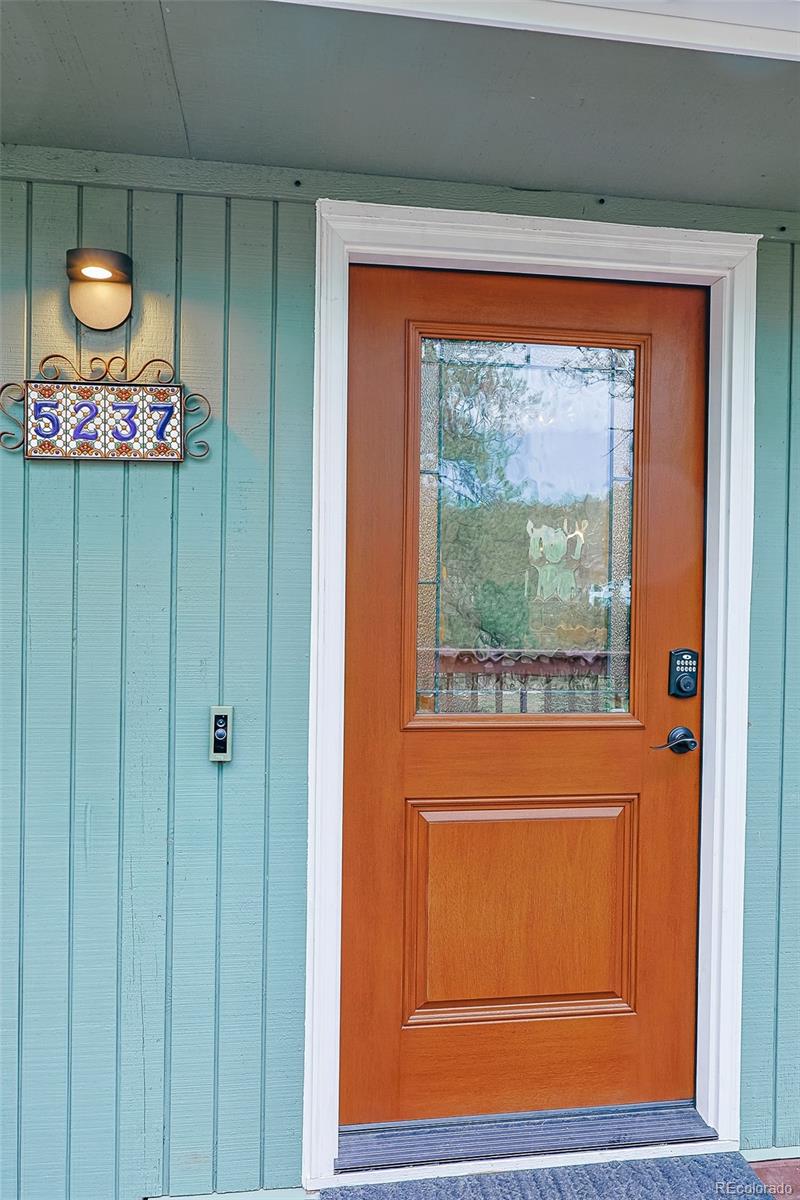 5237 South Olive Road Evergreen, CO 80439 - Photo 6 of 31 a view of a door and a window