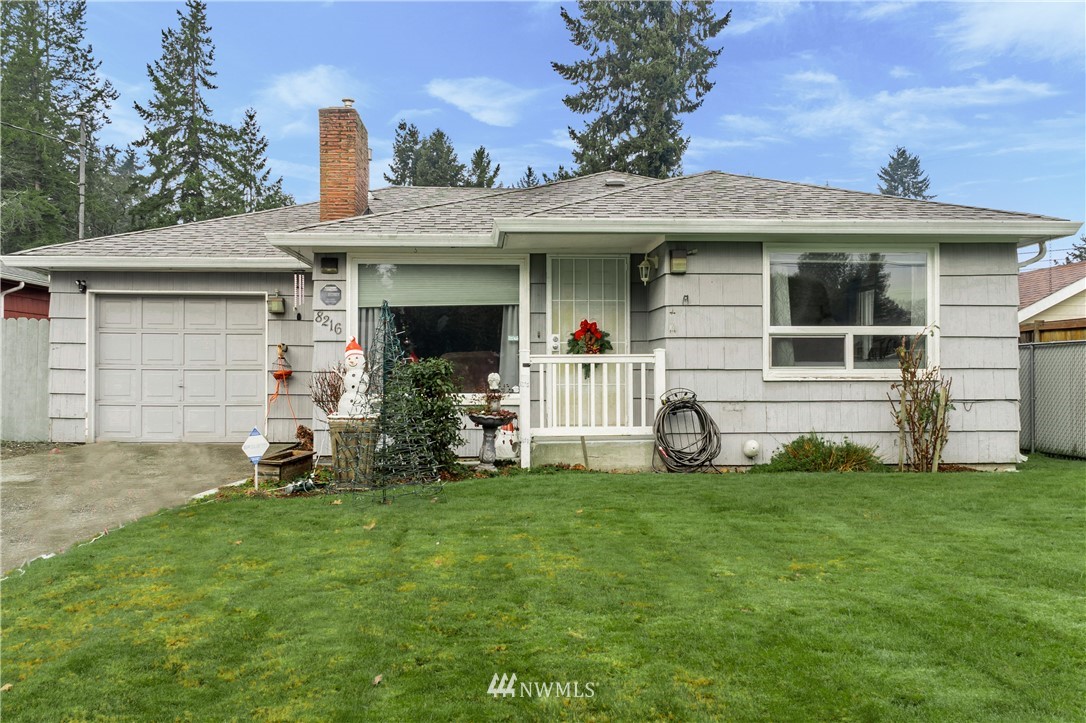 8216 Custer Road Southwest Lakewood, WA 98499 - Photo 1 of 20 a view of a house with backyard