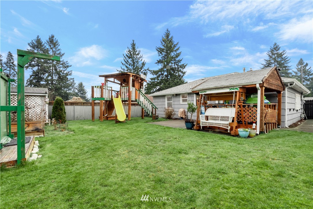 8216 Custer Road Southwest Lakewood, WA 98499 - Photo 12 of 20 a view of front of house with a big yard