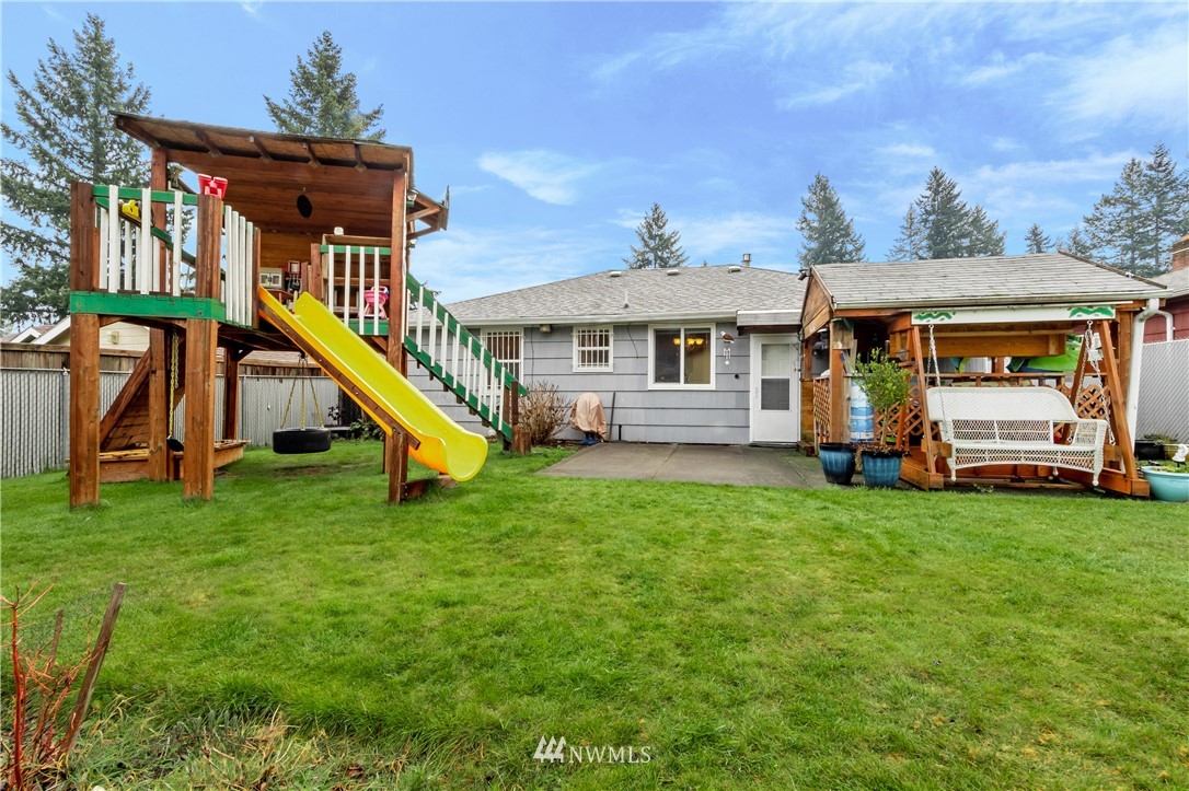 8216 Custer Road Southwest Lakewood, WA 98499 - Photo 14 of 20 a view of a house with a backyard