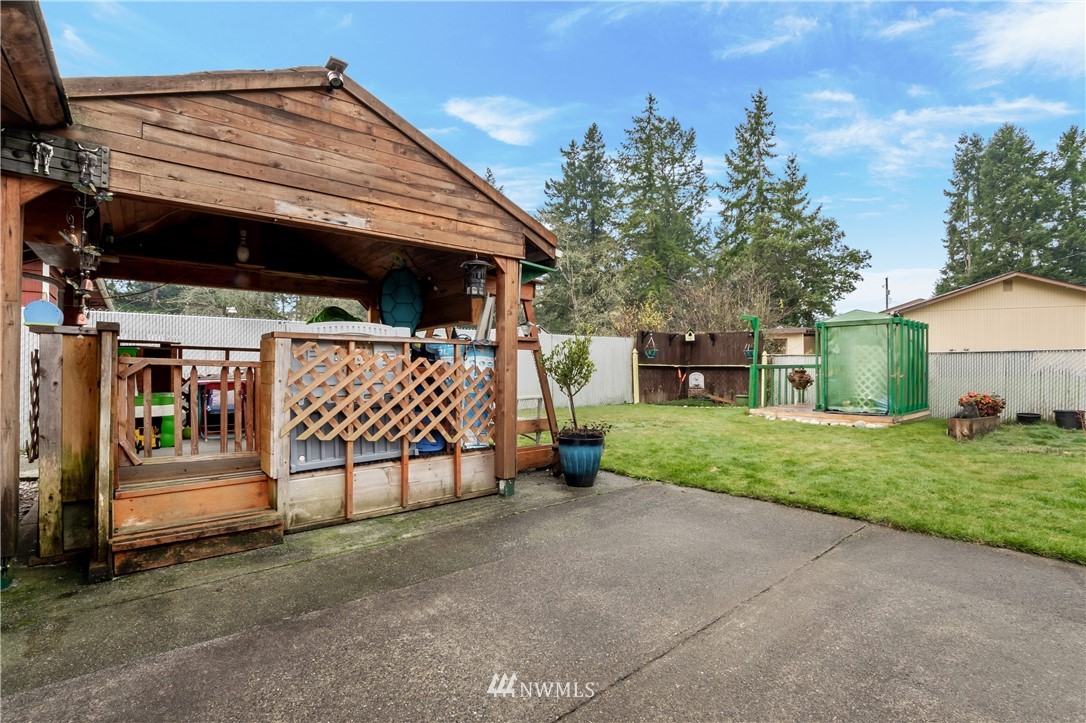 8216 Custer Road Southwest Lakewood, WA 98499 - Photo 15 of 20 a view of a house with a yard