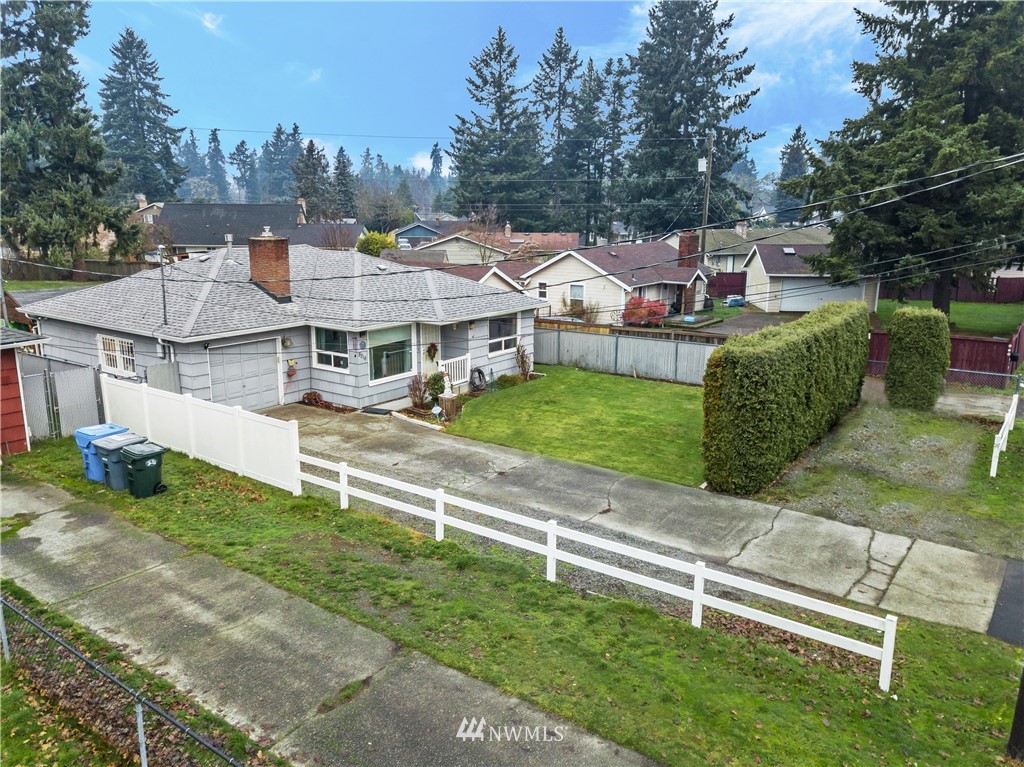 8216 Custer Road Southwest Lakewood, WA 98499 - Photo 17 of 20 a view of a house with a yard and sitting area