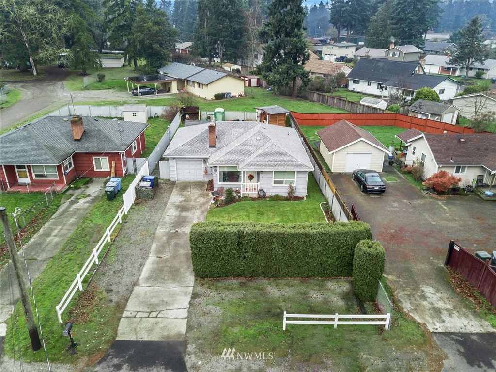 8216 Custer Road Southwest Lakewood, WA 98499 - Photo 18 of 20 an aerial view of a house with swimming pool and garden
