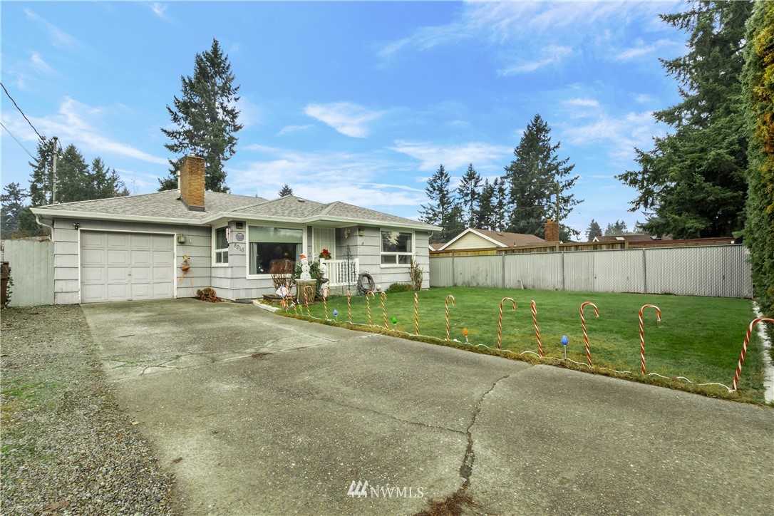 8216 Custer Road Southwest Lakewood, WA 98499 - Photo 20 of 20 a front view of a house with garden