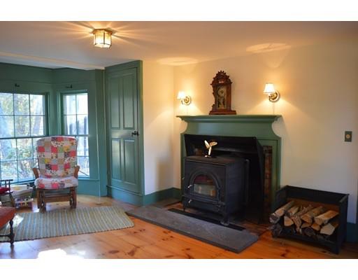 27 Whitney Road Stow, MA 01775 - Photo 13 of 24 a living room with furniture and a fireplace