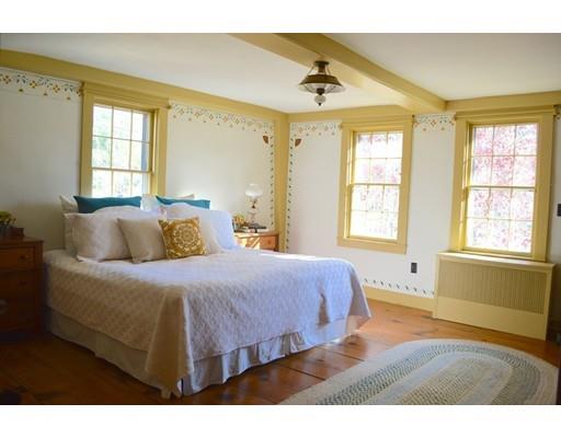 27 Whitney Road Stow, MA 01775 - Photo 18 of 24 a bedroom with a bed and wooden floor