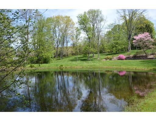 27 Whitney Road Stow, MA 01775 - Photo 20 of 24 a view of a lake with a yard