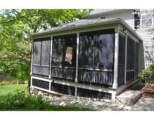 27 Whitney Road Stow, MA 01775 - Photo 5 of 24 a view of small house with a large window and potted plants
