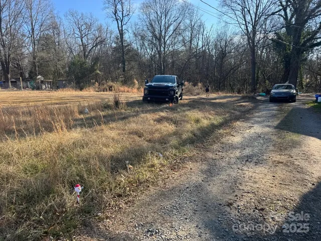 a side view of a house with a yard
