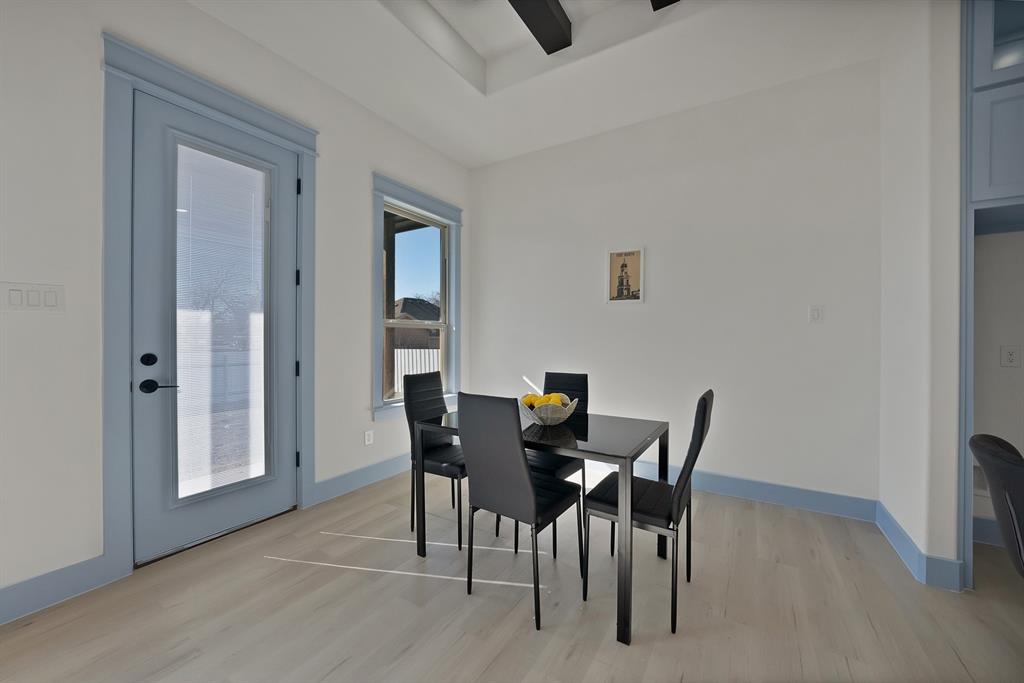 4754 Ramey Avenue Fort Worth, TX 76105 - Photo 14 of 31 a view of a dining room with furniture and wooden floor