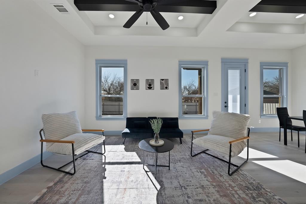 4754 Ramey Avenue Fort Worth, TX 76105 - Photo 15 of 31 a living room with furniture a rug and a window