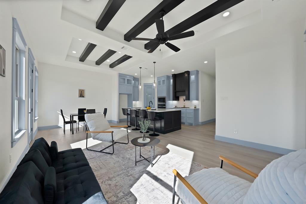 4754 Ramey Avenue Fort Worth, TX 76105 - Photo 16 of 31 a living room with lots of furniture and kitchen view