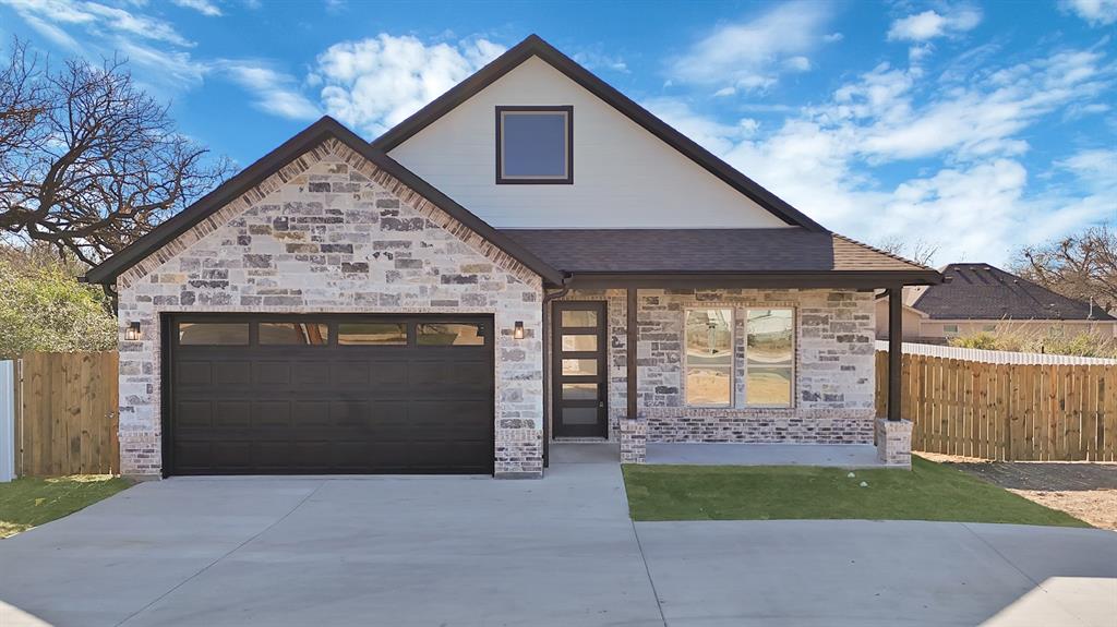 4754 Ramey Avenue Fort Worth, TX 76105 - Photo 2 of 31 a front view of a house with a yard and garage