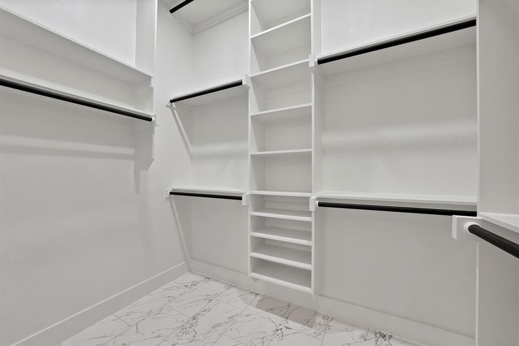 4754 Ramey Avenue Fort Worth, TX 76105 - Photo 25 of 31 a view of walk in closet with empty racks