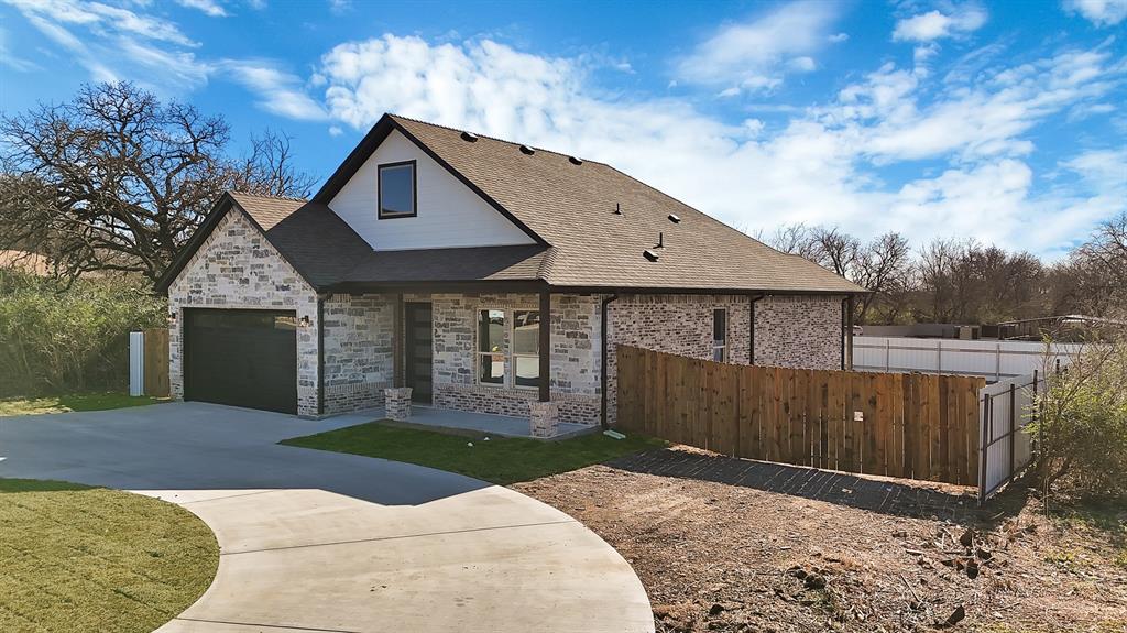 4754 Ramey Avenue Fort Worth, TX 76105 - Photo 4 of 31 a front view of a house with a yard and garage