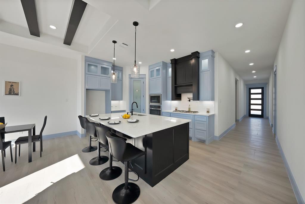 4754 Ramey Avenue Fort Worth, TX 76105 - Photo 9 of 31 a large kitchen with a table and chairs