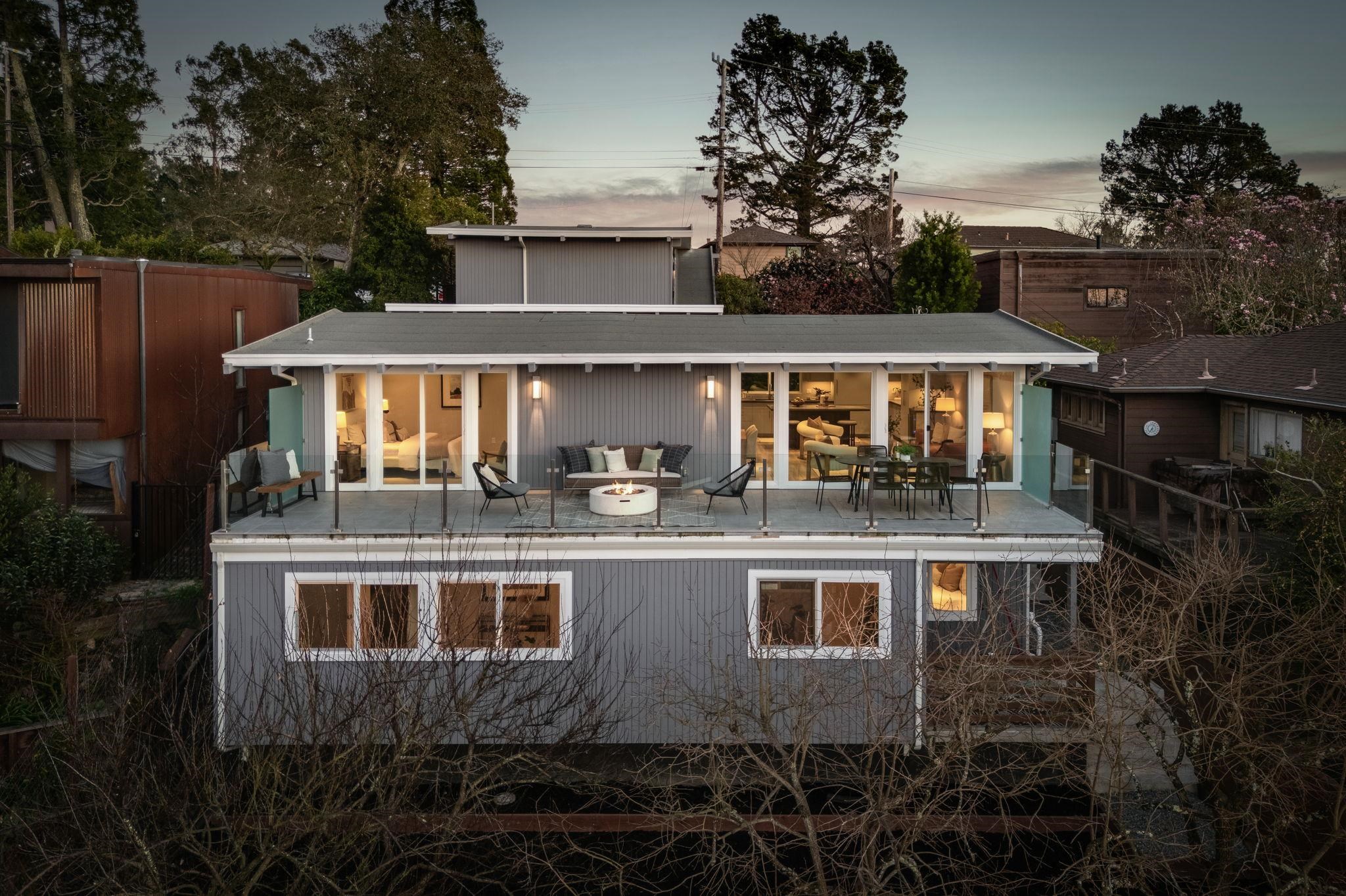 Rear view of property with a patio and outdoor lounge area