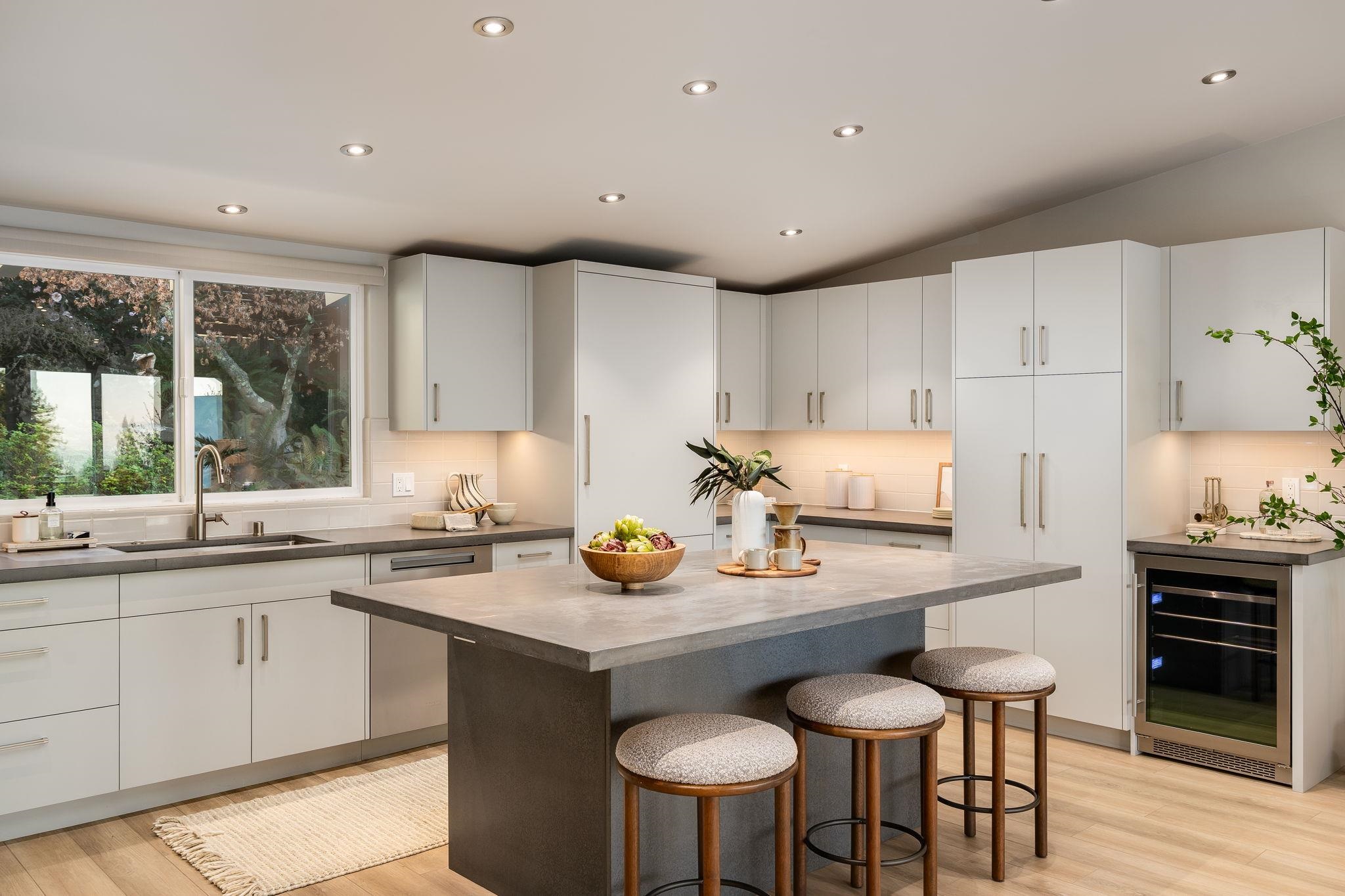 1468 Summit Road Berkeley, CA 94708 - Photo 14 of 59 Kitchen with wine cooler, a breakfast bar area, light wood-style floors, white cabinetry, and backsplash