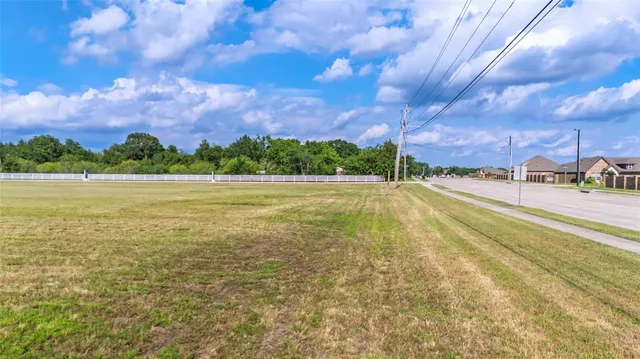 a view of a lake with houses in the background